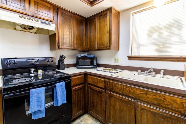823 Two Forty Pl, Oklahoma City, OK 73139 - kitchen featuring black appliances, under cabinet range hood, and a sink
