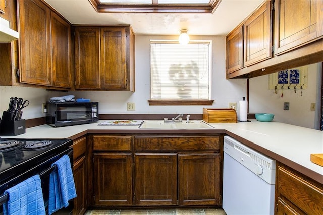 823 Two Forty Pl, Oklahoma City, OK 73139 - kitchen with black appliances, a sink, light countertops, and under cabinet range hood