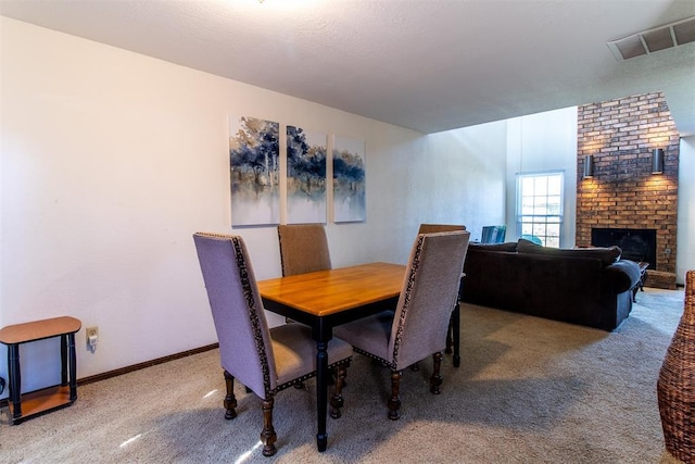 823 Two Forty Pl, Oklahoma City, OK 73139 - dining space featuring carpet flooring, a fireplace, and baseboards