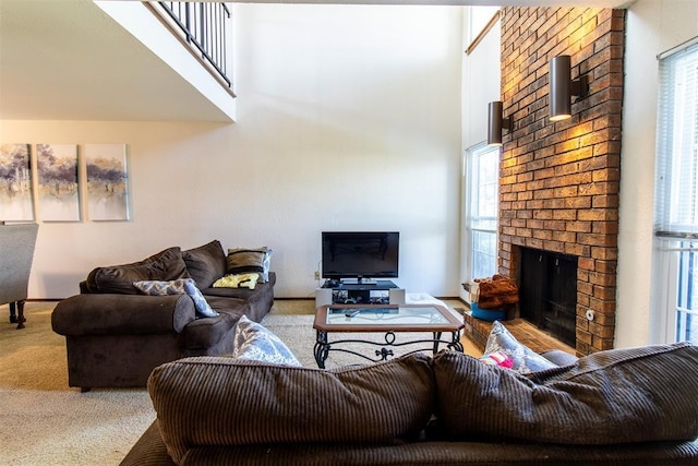 823 Two Forty Pl, Oklahoma City, OK 73139 - carpeted living room with plenty of natural light, a brick fireplace, baseboards, and a towering ceiling