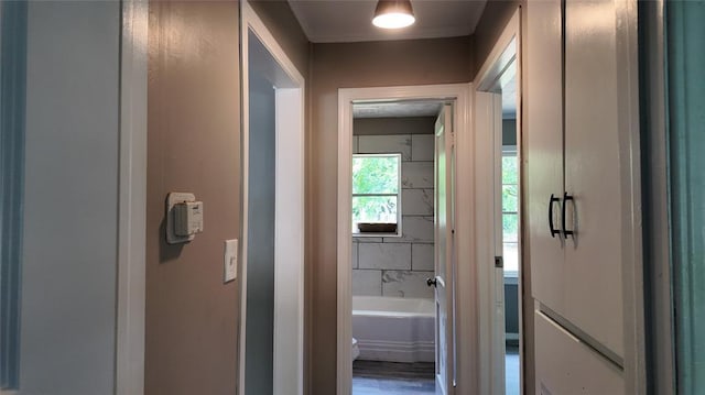 617 Holman Pl, Midwest City, OK 73110 - bathroom with a bathtub, wood finished floors, and toilet