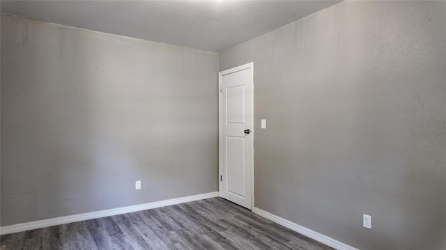 617 Holman Pl, Midwest City, OK 73110 - spare room with wood finished floors and baseboards