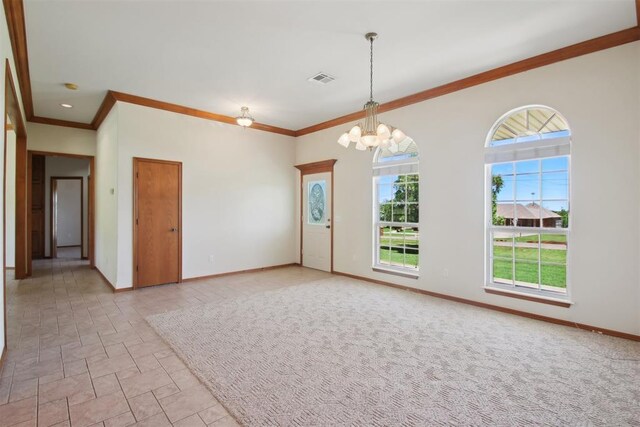 1227 Stout Dr NW, Piedmont, OK 73078 - empty room with a chandelier, healthy amount of natural light, baseboards, and crown molding