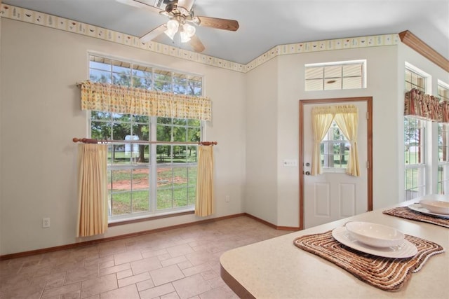 1227 Stout Dr NW, Piedmont, OK 73078 - foyer with light stone finish flooring, ceiling fan, and baseboards