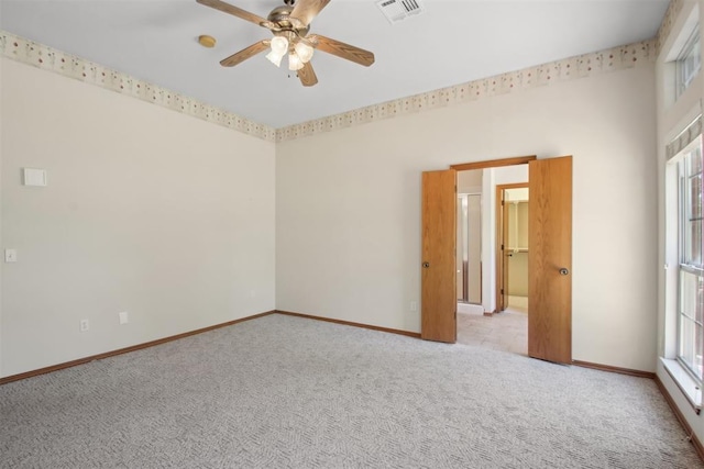 1227 Stout Dr NW, Piedmont, OK 73078 - carpeted empty room featuring a ceiling fan and baseboards
