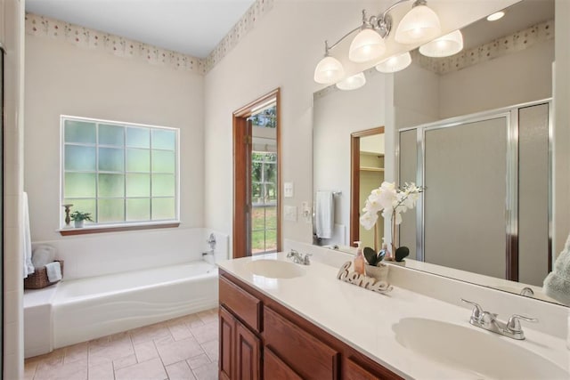 1227 Stout Dr NW, Piedmont, OK 73078 - bathroom featuring a stall shower, a garden tub, and double vanity