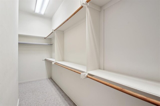 1227 Stout Dr NW, Piedmont, OK 73078 - spacious closet featuring light carpet