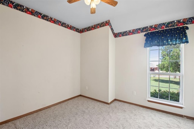 1227 Stout Dr NW, Piedmont, OK 73078 - spare room featuring a ceiling fan, carpet flooring, and baseboards