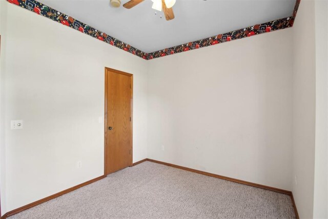 1227 Stout Dr NW, Piedmont, OK 73078 - empty room featuring carpet floors, ceiling fan, and baseboards