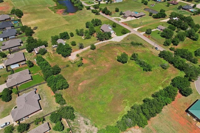 1227 Stout Dr NW, Piedmont, OK 73078 - view of property location with nearby suburban area and a large body of water