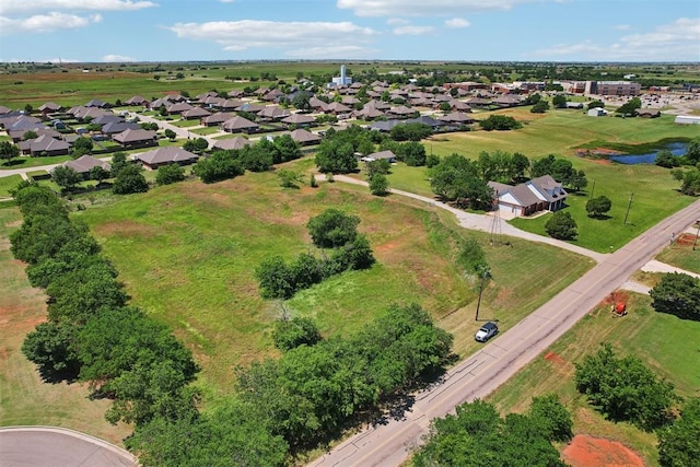 1227 Stout Dr NW, Piedmont, OK 73078 - aerial view of residential area with a nearby body of water
