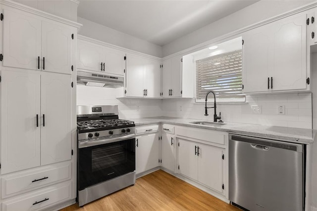 6 Utah Ave, Yukon, OK 73099 - kitchen with appliances with stainless steel finishes, a sink, under cabinet range hood, and white cabinets