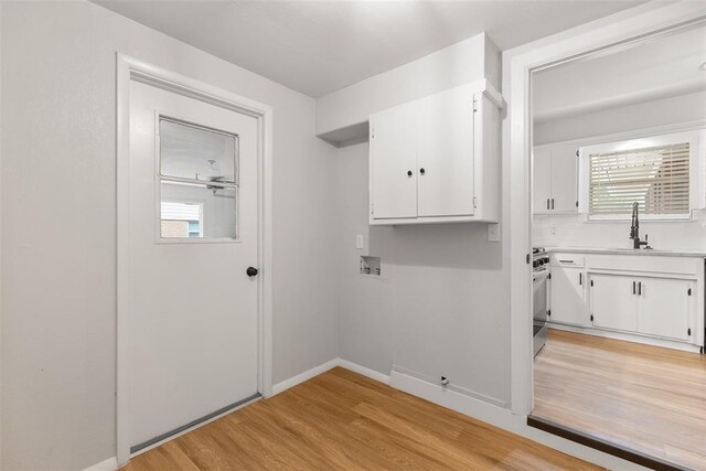 6 Utah Ave, Yukon, OK 73099 - washroom with light wood-type flooring and baseboards