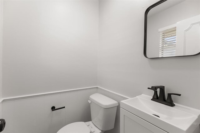 6 Utah Ave, Yukon, OK 73099 - half bath with toilet, vanity, and a wainscoted wall