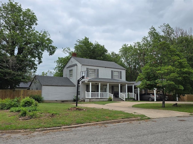 915 NW Euclid Ave, Lawton, OK 73507 - view of front of home with covered porch, a chimney, driveway, and crawl space