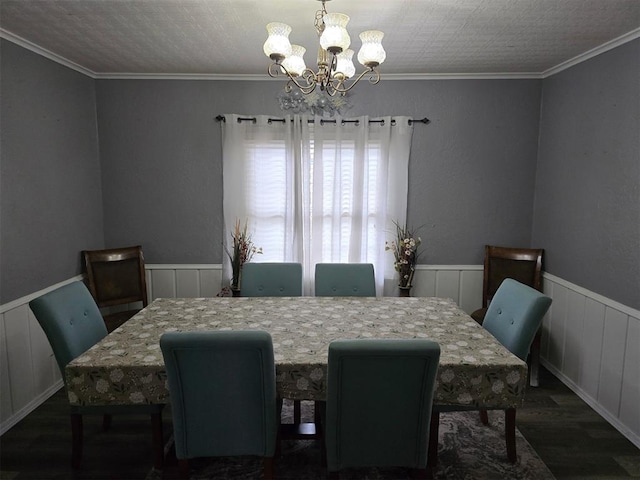 915 NW Euclid Ave, Lawton, OK 73507 - dining room with wood finished floors, a chandelier, and wainscoting