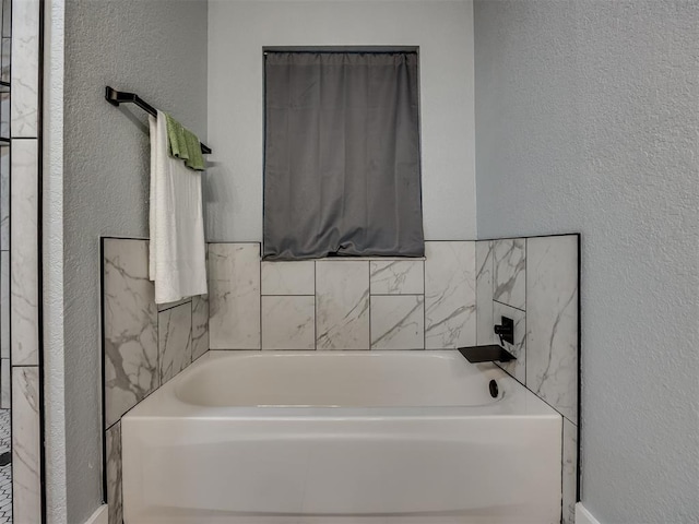 1900 New Haven Ct, Moore, OK 73160 - bathroom with a textured wall and a bath