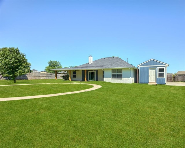1900 New Haven Ct, Moore, OK 73160 - rear view of property with a chimney