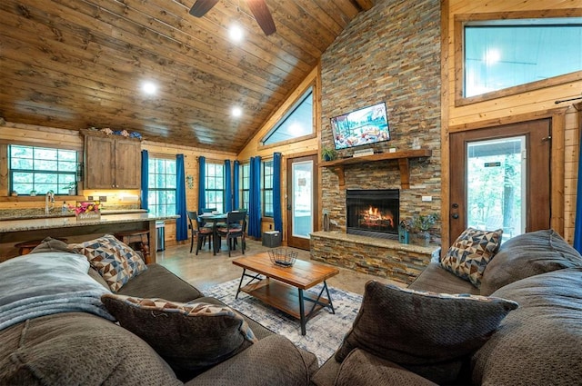 295 Orca Rd, Broken Bow, OK 74728 - living room featuring high vaulted ceiling, ceiling fan, a stone fireplace, light wood-type flooring, and recessed lighting