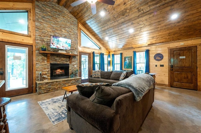 295 Orca Rd, Broken Bow, OK 74728 - living area featuring concrete flooring, wooden ceiling, high vaulted ceiling, a ceiling fan, and a stone fireplace