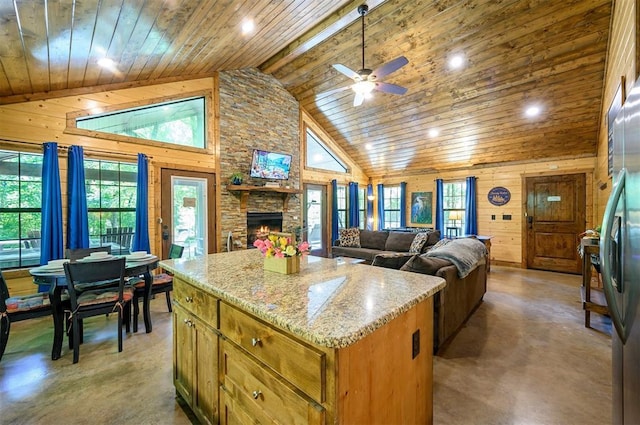 295 Orca Rd, Broken Bow, OK 74728 - kitchen featuring wooden ceiling, concrete flooring, ceiling fan, a fireplace, and recessed lighting