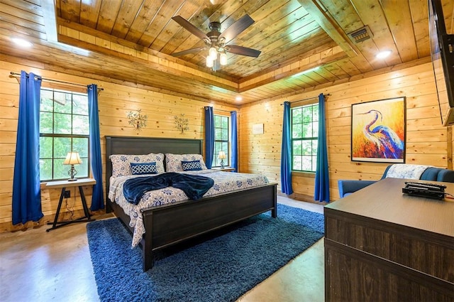 295 Orca Rd, Broken Bow, OK 74728 - bedroom with wooden ceiling, finished concrete flooring, multiple windows, wood walls, and a raised ceiling