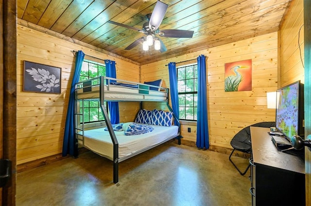 295 Orca Rd, Broken Bow, OK 74728 - bedroom featuring wood walls, wooden ceiling, multiple windows, and concrete flooring