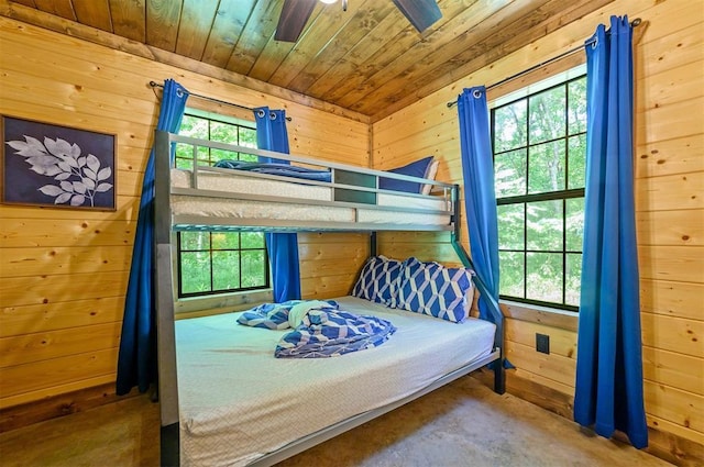 295 Orca Rd, Broken Bow, OK 74728 - bedroom featuring wood walls, wood ceiling, and concrete flooring