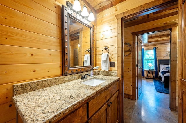 295 Orca Rd, Broken Bow, OK 74728 - bathroom featuring wooden walls, concrete flooring, vanity, and wood ceiling