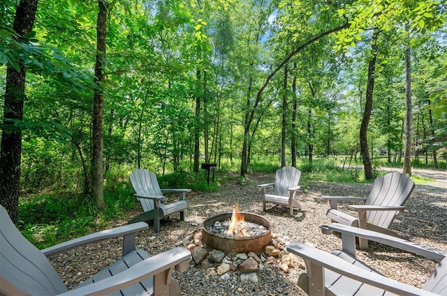 295 Orca Rd, Broken Bow, OK 74728 - view of patio / terrace with a fire pit