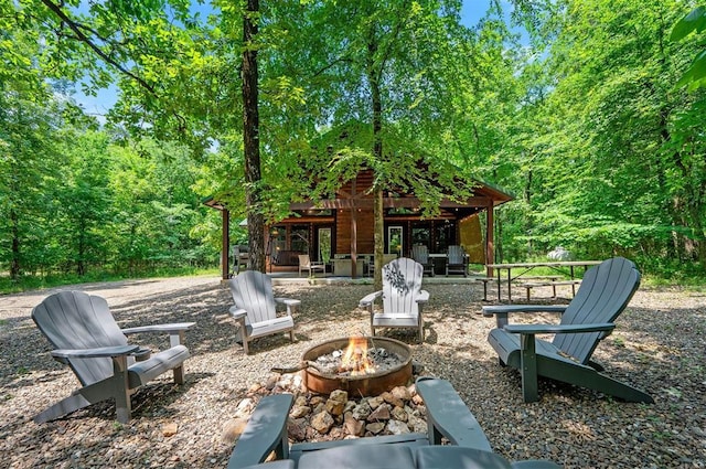 295 Orca Rd, Broken Bow, OK 74728 - view of patio / terrace featuring an outdoor fire pit