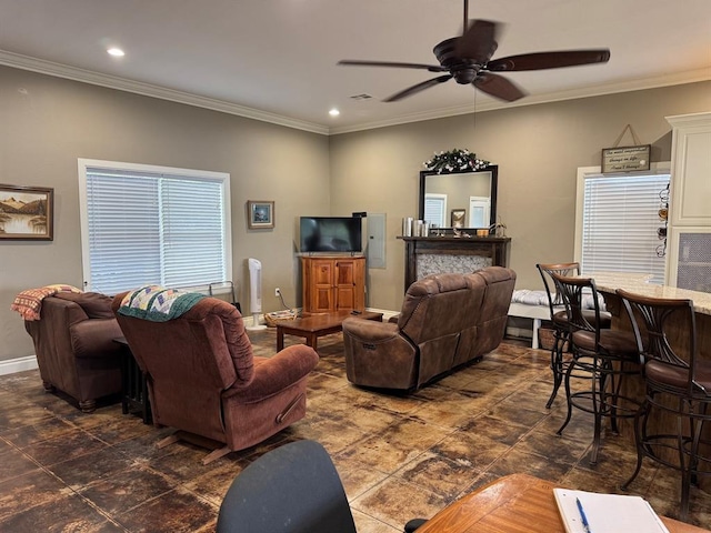 17308 Magnino Rd, Shawnee, OK 74801 - living room with ornamental molding, ceiling fan, baseboards, recessed lighting, and dark stone finish floors