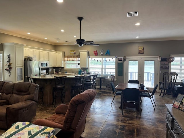 17308 Magnino Rd, Shawnee, OK 74801 - living room with a ceiling fan, ornamental molding, recessed lighting, and french doors