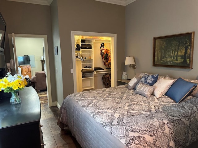 17308 Magnino Rd, Shawnee, OK 74801 - tiled bedroom featuring ornamental molding, a spacious closet, and a closet