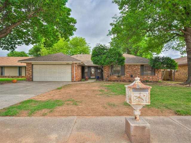209 E Platt Dr, Yukon, OK 73099 - ranch-style home featuring an attached garage, concrete driveway, brick siding, and a front yard