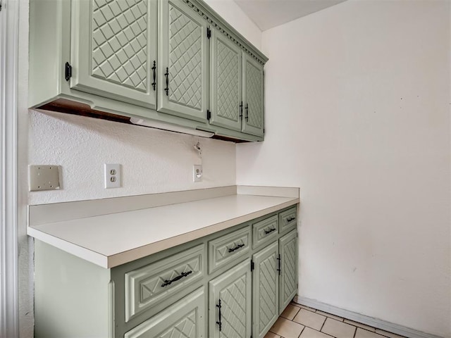 209 E Platt Dr, Yukon, OK 73099 - kitchen featuring light countertops, light tile patterned floors, and green cabinetry