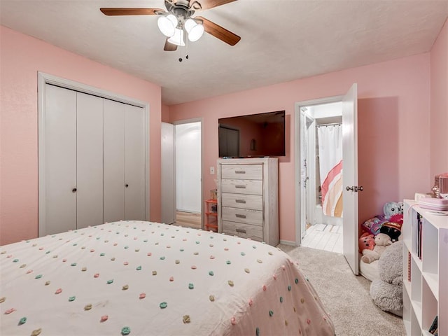 209 E Platt Dr, Yukon, OK 73099 - carpeted bedroom with a closet, ceiling fan, and ensuite bath