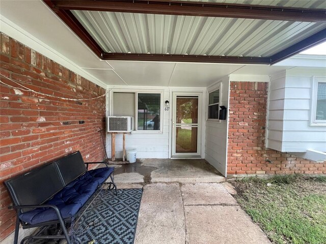 617 Mark Dr, Oklahoma City, OK 73115 - view of exterior entry with brick siding and a patio
