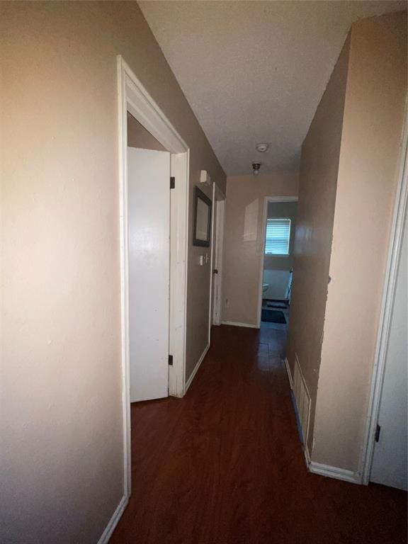 617 Mark Dr, Oklahoma City, OK 73115 - hallway featuring wood finished floors and baseboards