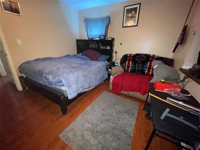 617 Mark Dr, Oklahoma City, OK 73115 - bedroom featuring wood finished floors