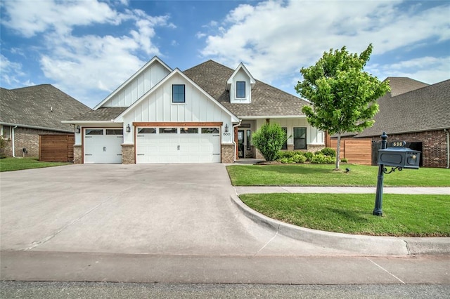 600 NW 186th St, Edmond, OK 73012 - craftsman house with a garage, board and batten siding, driveway, brick siding, and a shingled roof