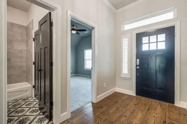 600 NW 186th St, Edmond, OK 73012 - foyer entrance featuring ornamental molding, dark wood finished floors, baseboards, and ceiling fan