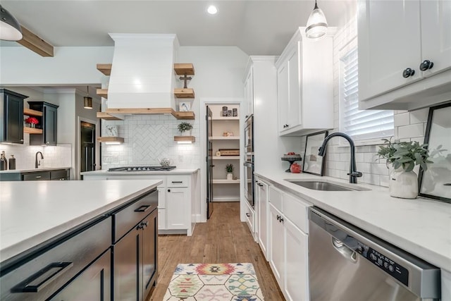 600 NW 186th St, Edmond, OK 73012 - kitchen with open shelves, appliances with stainless steel finishes, a sink, decorative backsplash, and recessed lighting