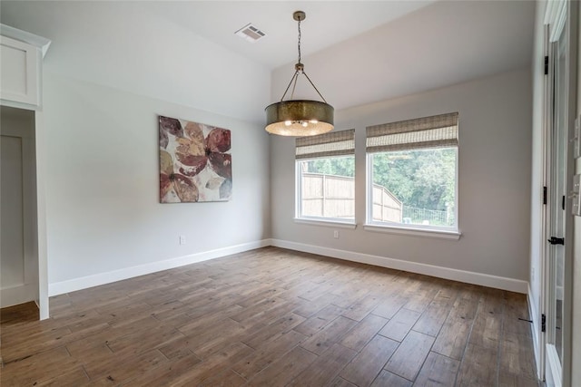 600 NW 186th St, Edmond, OK 73012 - spare room featuring dark wood-type flooring, baseboards, and vaulted ceiling