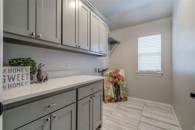 600 NW 186th St, Edmond, OK 73012 - laundry area with cabinet space, washer hookup, baseboards, and hookup for an electric dryer