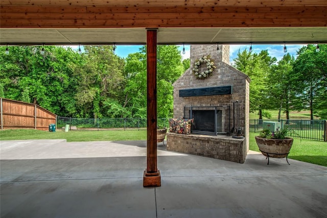 600 NW 186th St, Edmond, OK 73012 - view of patio with an outdoor brick fireplace