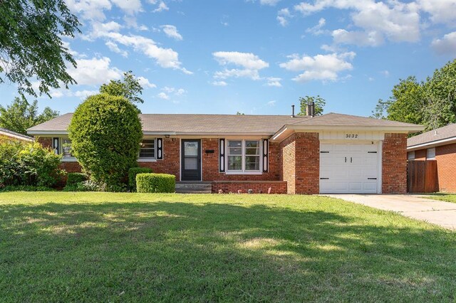 3032 NW 67th St, Oklahoma City, OK 73116 - ranch-style house featuring brick siding, an attached garage, and concrete driveway