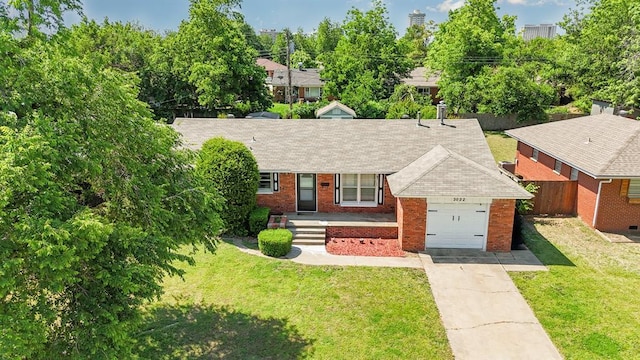 3032 NW 67th St, Oklahoma City, OK 73116 - view of front of home featuring a garage, brick siding, concrete driveway, and a shingled roof