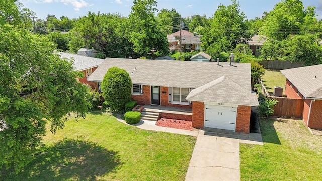 3032 NW 67th St, Oklahoma City, OK 73116 - ranch-style home with a garage, concrete driveway, brick siding, and roof with shingles