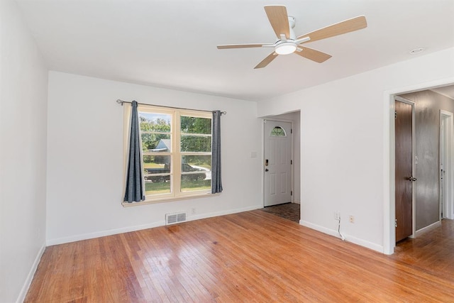 3032 NW 67th St, Oklahoma City, OK 73116 - unfurnished room with light wood-type flooring, a ceiling fan, and baseboards